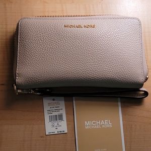 Michael Kors light pink leather cell phone wristlet jet travel size
